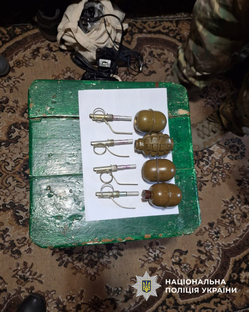 Five hand grenades with fuzes laid out on a white sheet atop a green bench, as police display evidence (Ukrainian National Police watermark).