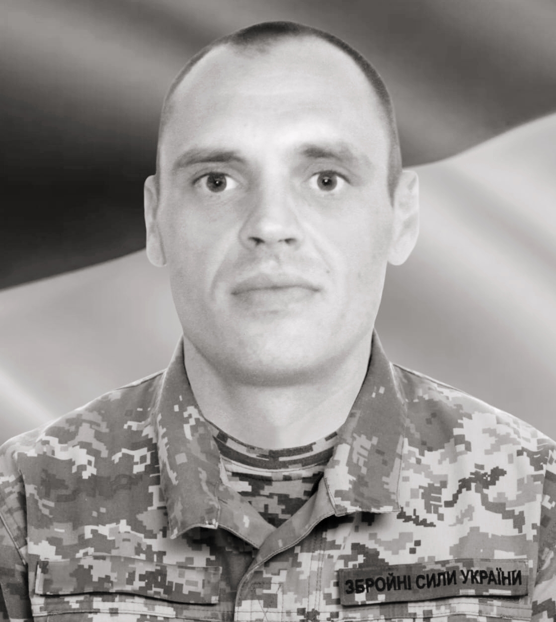 Portrait of a man in Ukrainian military camouflage, with a patch that reads 'Збройні сили України' on his chest.
